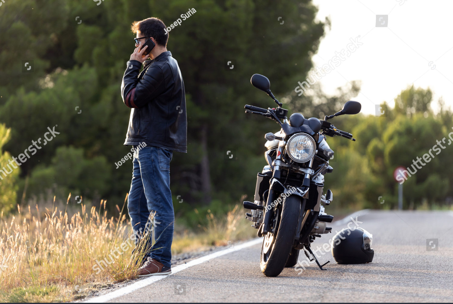 stock-photo-shot-of-man-biker-talking-on-the-phone-to-the-insurance-of-his-motorcycle-after-having-suffered-a-1527139100